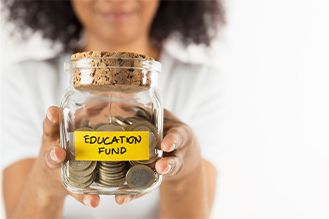 jar with a sticky note for education fund